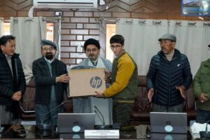 CEC Dr Jaffer distributes laptops to meritorious students